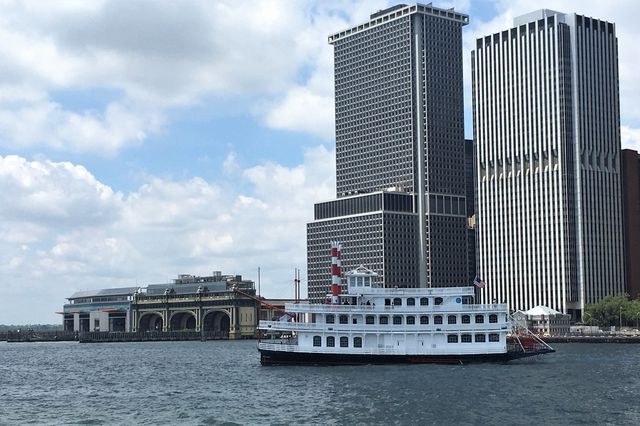 A photo of a "show boat"-style boat as seen on the East River in Lower Manhattan.